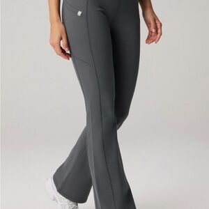 Fabletics StretchTech™ Kick Flare Scrub Legging in Onyx
